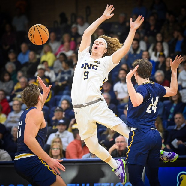 Northern Colorado's Jaron Rillie is fouled by his Northern Arizona defenders while playing at the Bank of Colorado Arena on Saturday Feb. 1, 2025 in Greeley.(Jim Rydbom/Staff Photographer)