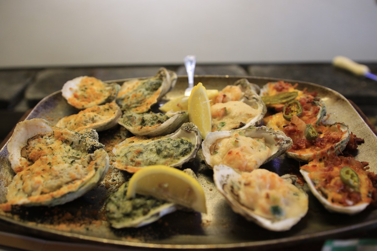 Oysters prepared four different ways on a plate in Mobile, Alabama.
