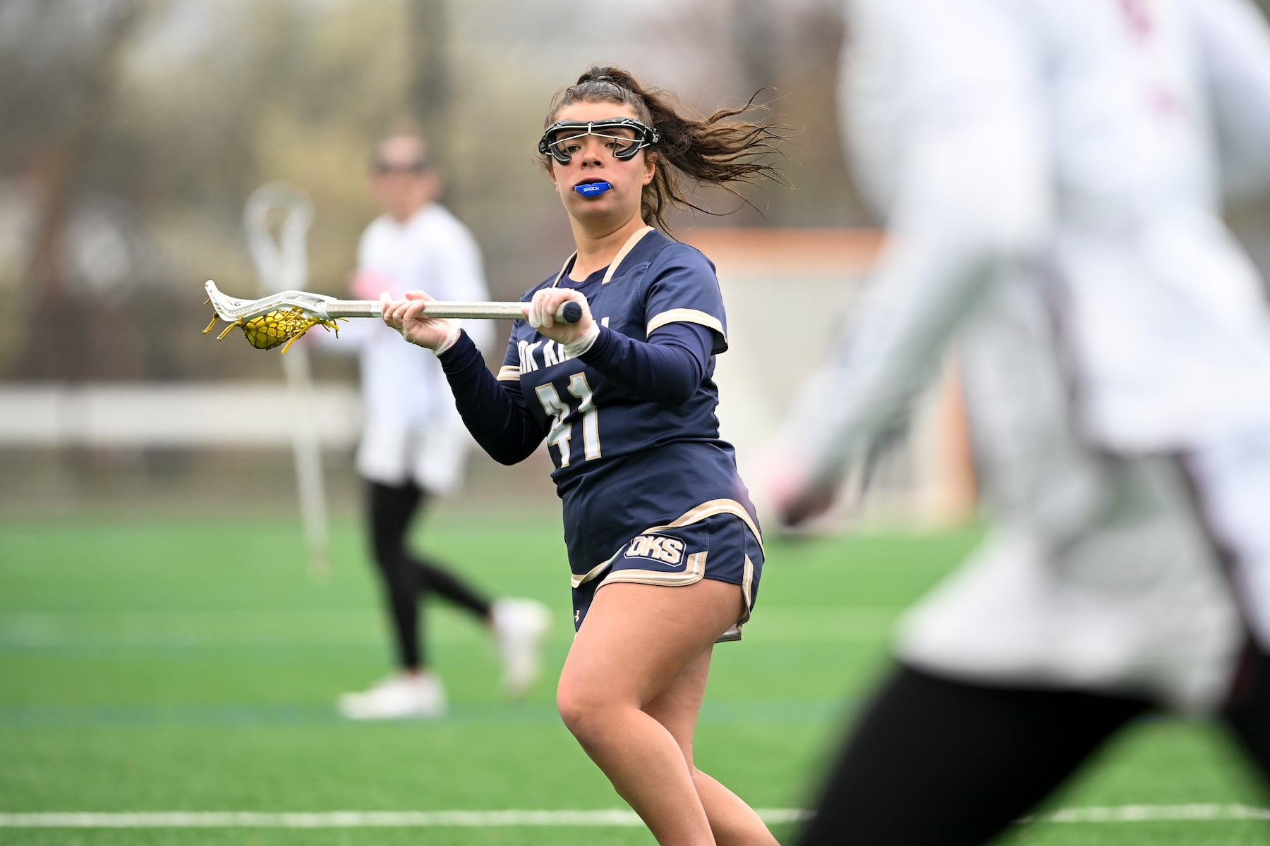 Taylor Martin (41) of Oak Knoll looks to take a shot over defender Francesca Arcella (9) of Summit during the girls lacrosse game between Oak Knoll and Summit at Oak Knoll High School in Chatham, NJ on Saturday, April 12, 2025.