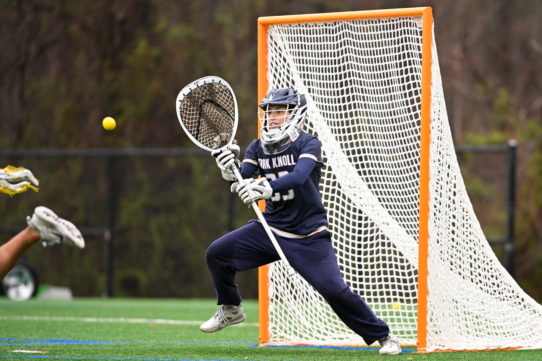 Alex Genua (33) of Oak Knoll attempts a save during the girls lacrosse game between Oak Knoll and Summit at Oak Knoll High School in Chatham, NJ on Saturday, April 12, 2025.