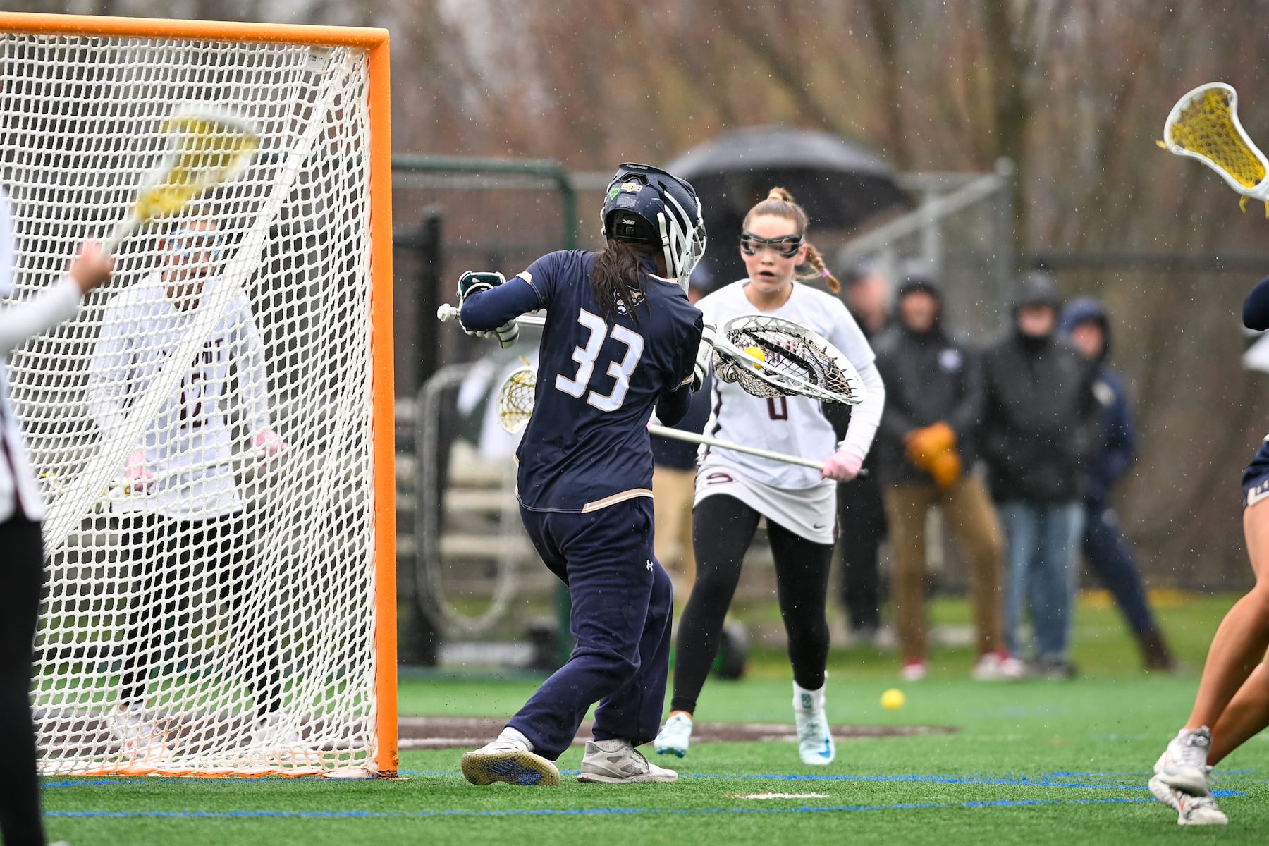 Alex Genua (33) of Oak Knoll makes a save during the girls lacrosse game between Oak Knoll and Summit at Oak Knoll High School in Chatham, NJ on Saturday, April 12, 2025.