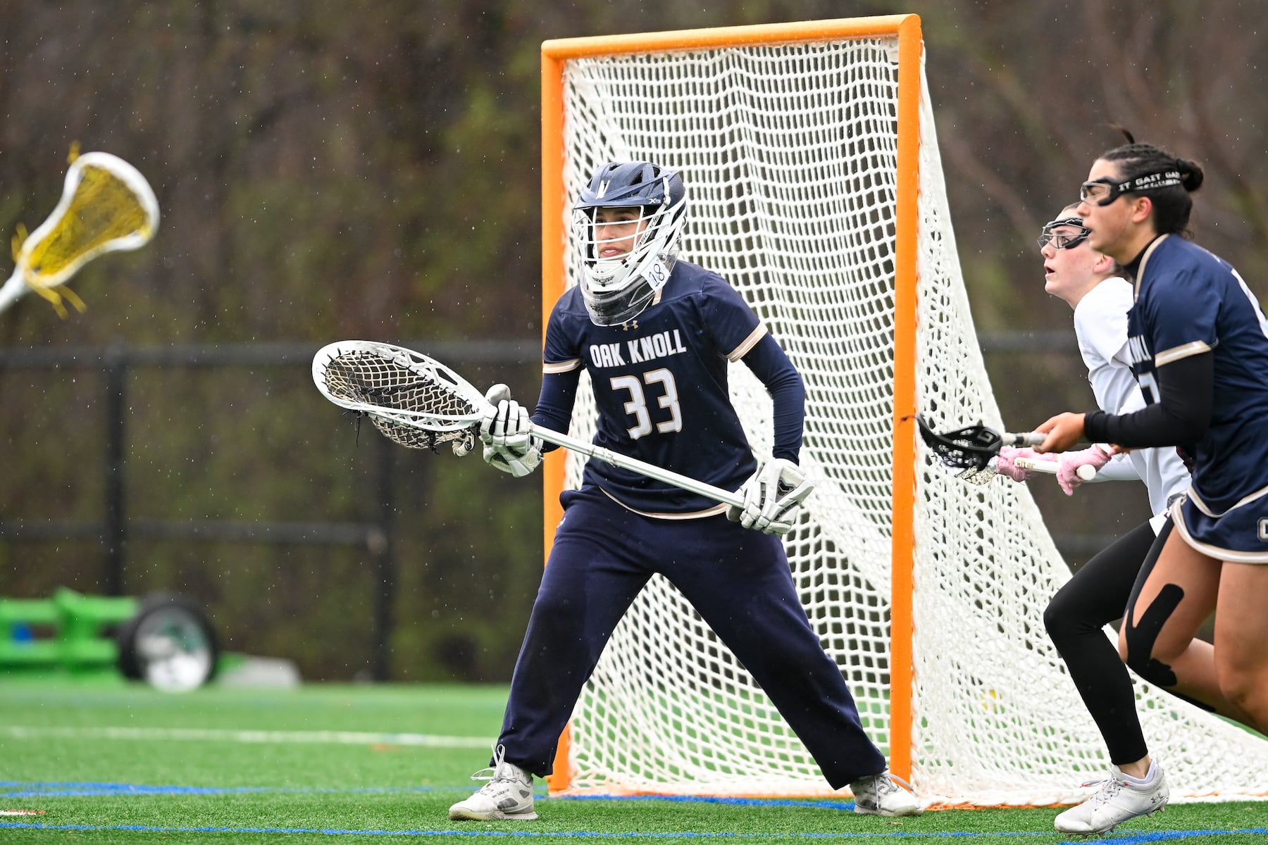 Alex Genua (33) of Oak Knoll defends the net during the girls lacrosse game between Oak Knoll and Summit at Oak Knoll High School in Chatham, NJ on Saturday, April 12, 2025.