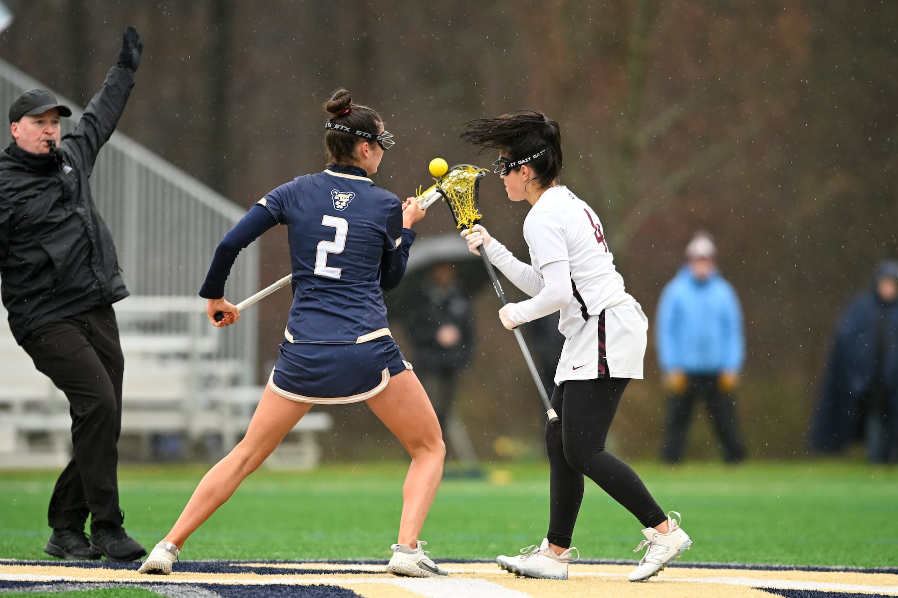 Maris Mcginty (2) of Oak Knoll faces off against Sara Scallon (4) of Summit during the girls lacrosse game between Oak Knoll and Summit at Oak Knoll High School in Chatham, NJ on Saturday, April 12, 2025.