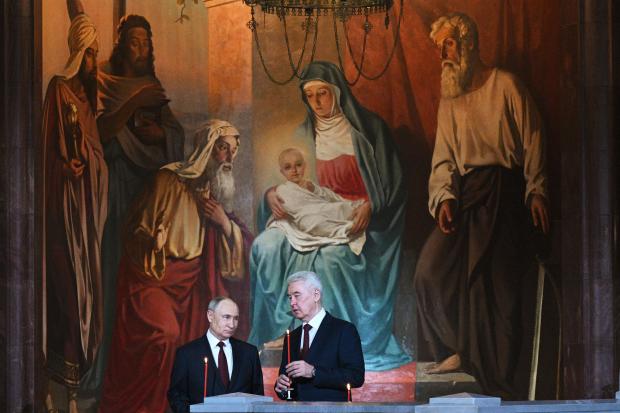 Russian President Vladimir Putin, left, and Moscow Mayor Sergei Sobyanin...