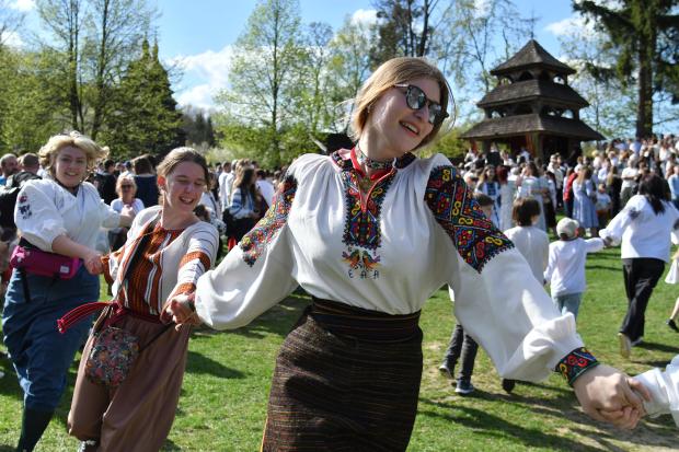 People in traditional Ukrainian clothes perform folk dances during celebrations...