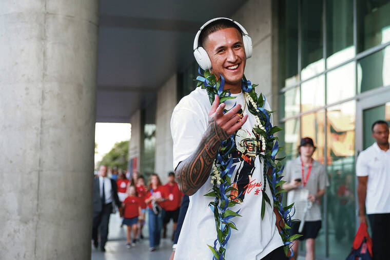ARYANNA FRANK / IMAGN IMAGES / OCT. 5
Arizona Wildcats wide receiver Tetairoa McMillan walks down the Wildcat Walk before a game against Texas Tech at Arizona Stadium in October. Waimanalo-born McMillan was chosen eighth by the Carolina Panthers in todays NFL Draft.