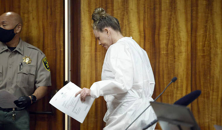 JAMM AQUINO / JAQUINO@STARADVERTISER.COM
Former Navy housewife Dixie Denise Villa, who appeared for sentencing in a white prison jumpsuit, did not address the court at the advice of counsel because she plans to appeal the case. She is seen departing after sentencing.