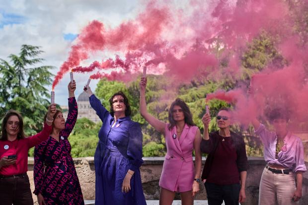 Activists from the Women's Ordination Conference release pink smoke