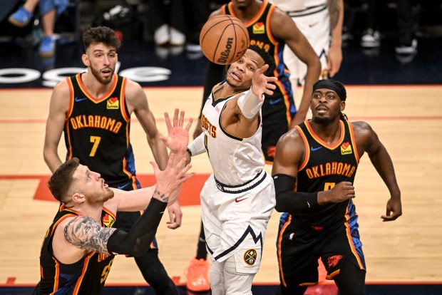 Russell Westbrook (4) of the Denver Nuggets battles Isaiah Hartenstein...