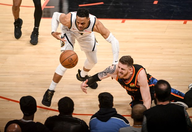 Russell Westbrook (4) of the Denver Nuggets and Isaiah Hartenstein...