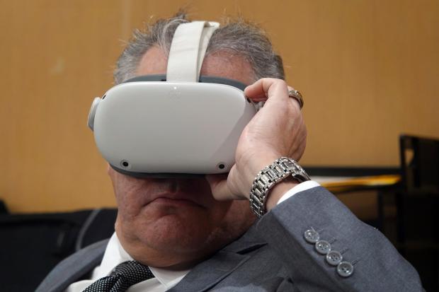 Miguel Rodriguez Albisu watches a virtual reality presentation Thursday, Dec....