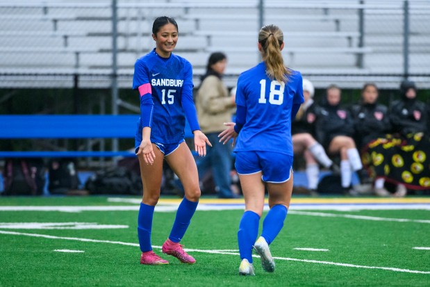 Carl Sandburg senior Gabby Dittmer (15) high-fives senior Grace Pittacora after Dittmer scored a goal at the Sandburg vs. Stagg Class 3A Joliet Central Regional girls soccer semifinal in Joliet, IL on Wednesday, May 21, 2025. (Andrew Burke-Stevenson/for the Daily Southtown)