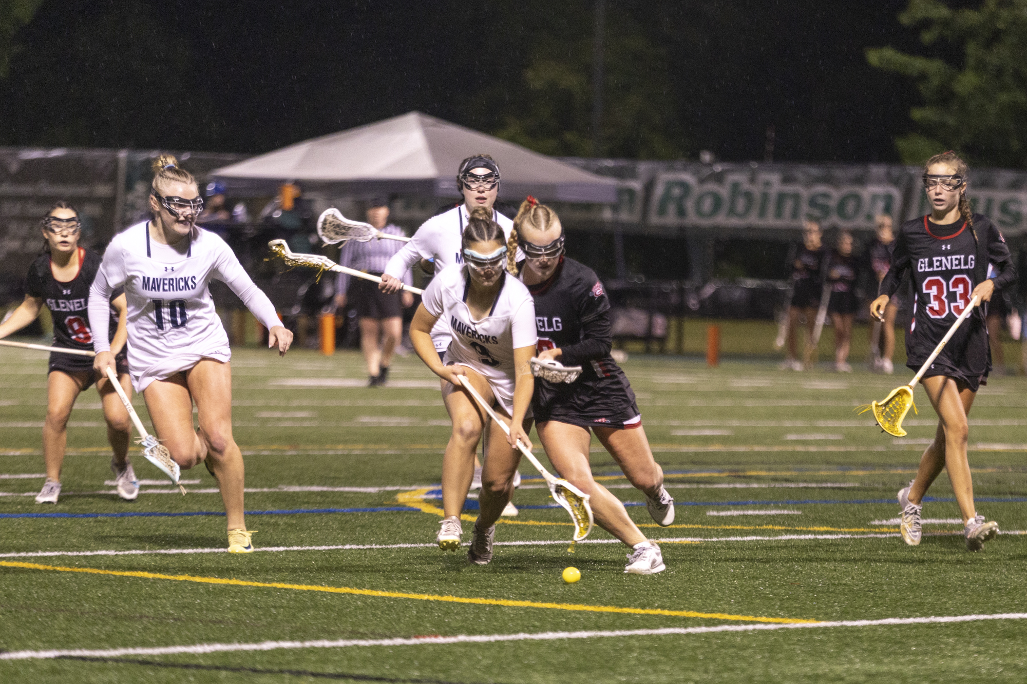 Manchester Valley’s Carolyn Lowe and Ava Baer fight for possession...