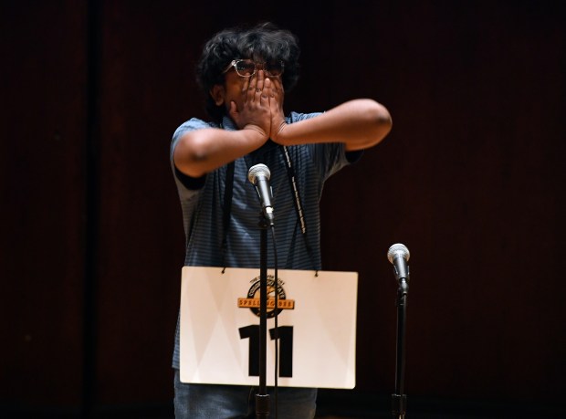 Vedanth Raju, a seventh grader from Aurora Quest K-8, reacts after spelling the championship word