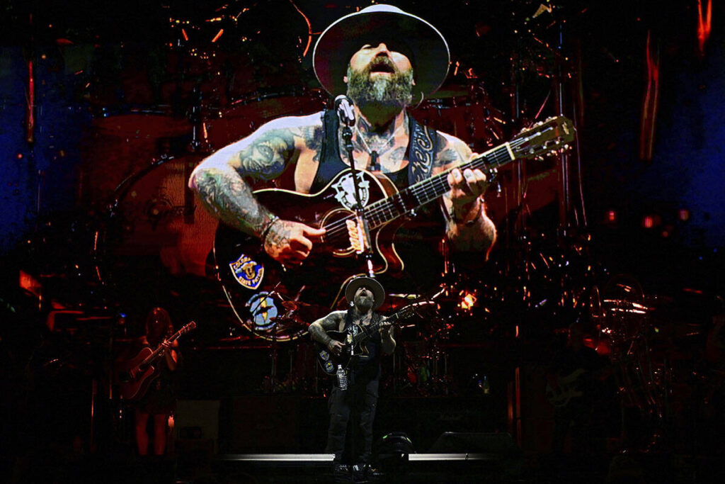 Zac Brown, center, performs with members of the Zac Brown Band during a concert Saturday Aug. 5 ...