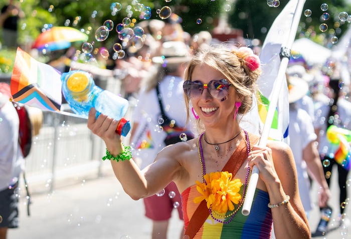 (Rick Egan | The Salt Lake Tribune) Kim Carpenter blows bubbles in the Pride Parade, on Sunday, June 8, 2025.
