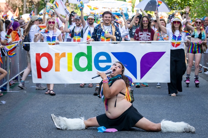 (Rick Egan | The Salt Lake Tribune) Jordan Knighton does the splits in the Pride Parade, on Sunday, June 8, 2025.