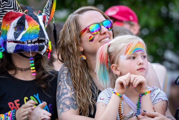 (Rick Egan | The Salt Lake Tribune) Lillian, Rachel and Ellie Hickenlooper watch the Pride Parade, on Sunday, June 8, 2025.