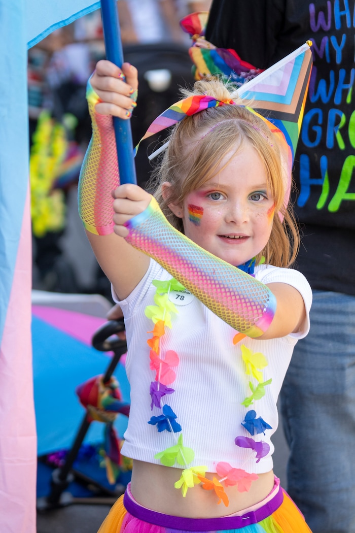 (Rick Egan | The Salt Lake Tribune) Sophie carries a flag in the Pride Parade, on Sunday, June 8, 2025.