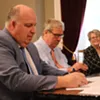Sen. Scott Beck (R-Caledonia) signing the compromise on Friday