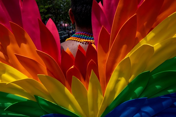 JD Aguilar of Tracks wears rainbow wings as he dances...