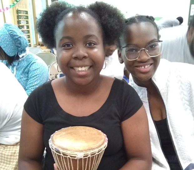 Calvin Christian School students London Stamps, left, and Nyleah Kelly took on supportive roles as music director and stage manager for a recent dramatic performance about freedom seeker Caroline Quarlls at Sand Ridge Nature Center in South Holland. (Susan DeGrane/Daily Southtown)