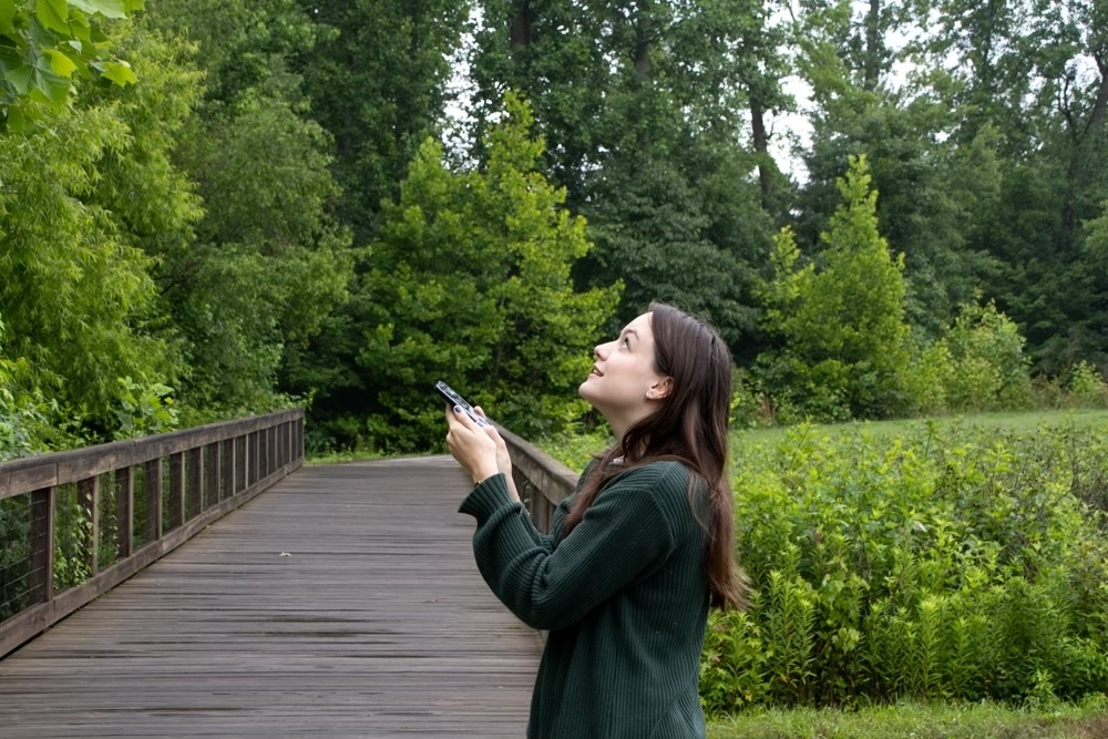 Above: Gabrielle Bunnell records birdsong as a volunteer for the Concrete Chorus Project. Photo by Paige Stevens — The 9th Street Journal