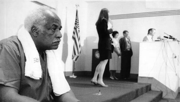 Lucius Robinson, a worker at the morgue, takes a break...