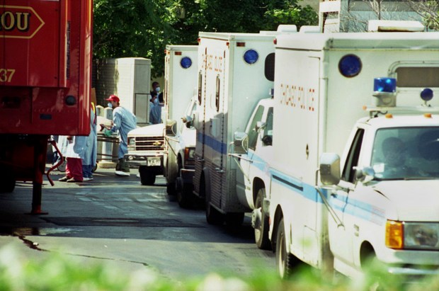 Chicago police wagons line up waiting to leave their cargos...