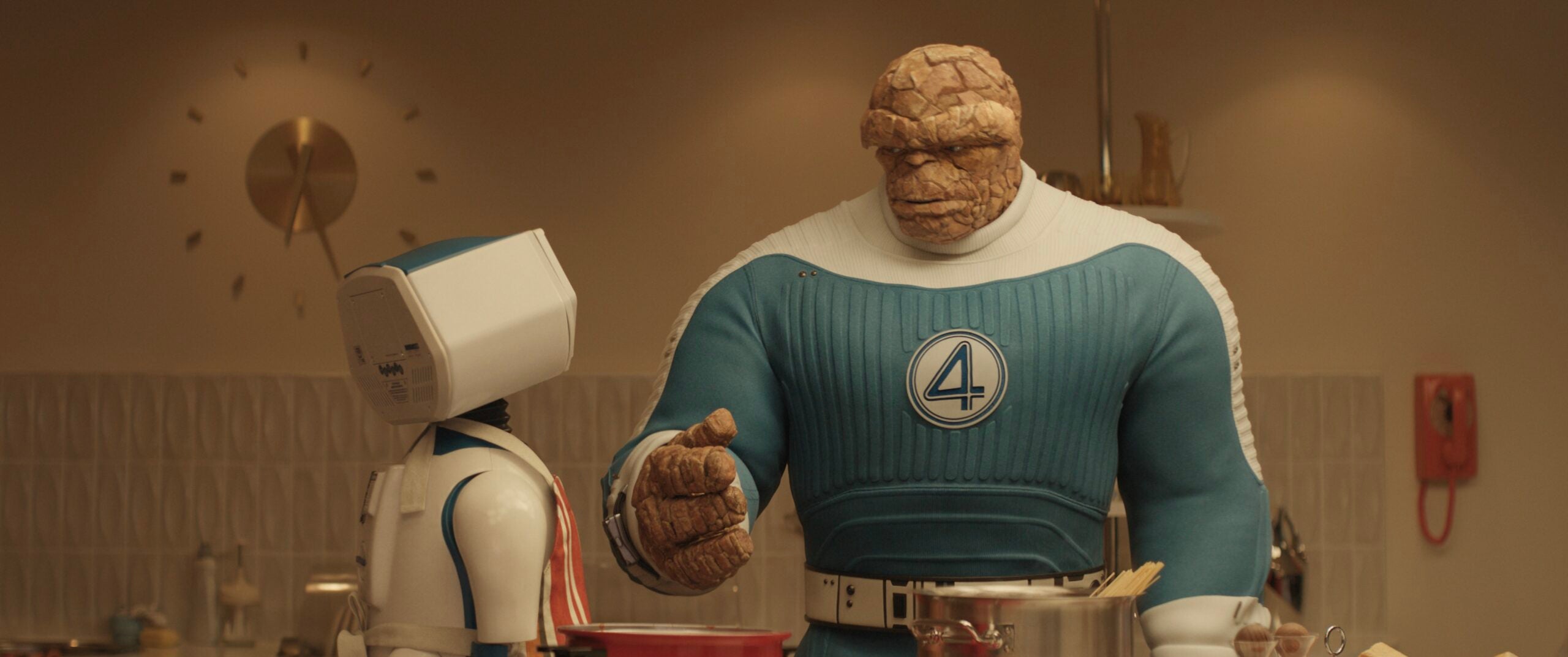 (L-R) H.E.R.B.I.E and Ebon Moss-Bachrach as Ben Grimm/The Thing in 20th Century Studios/Marvel Studios' THE FANTASTIC FOUR: FIRST STEPS.