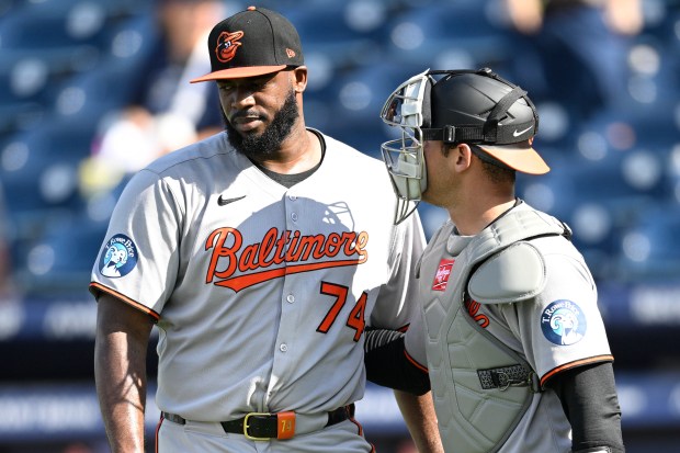 Baltimore Orioles pitcher Félix Bautista (74) is congratulated by catcher Alex Jackson, right, after getting the save in a baseball game against the Tampa Bay Rays, Sunday, July 20, 2025, in Tampa, Fla. (AP Photo/Phelan M. Ebenhack)