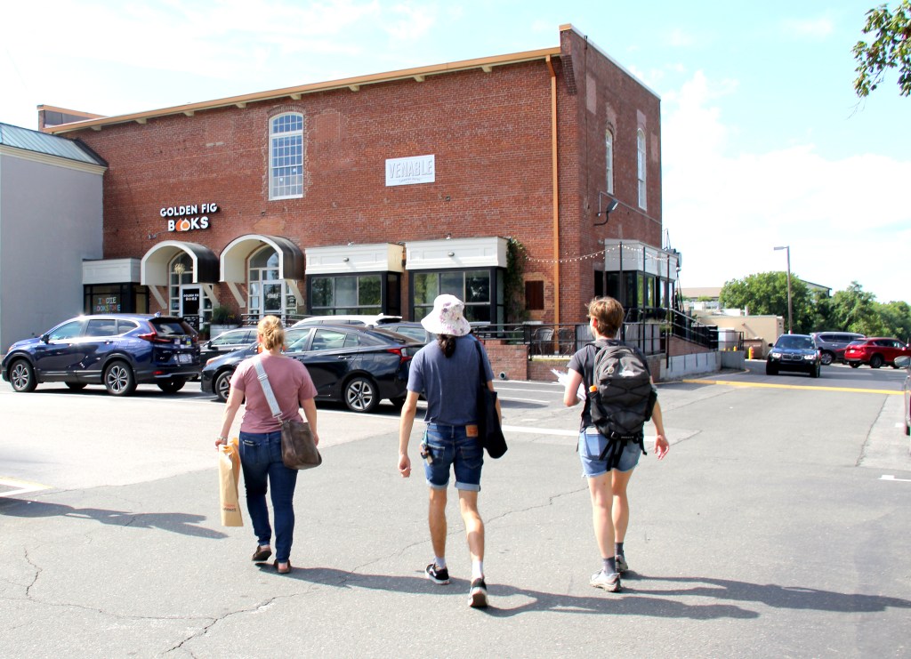 Volunteers from the Fourth Amendment Workplaces initiative visit Carrboro businesses in July.