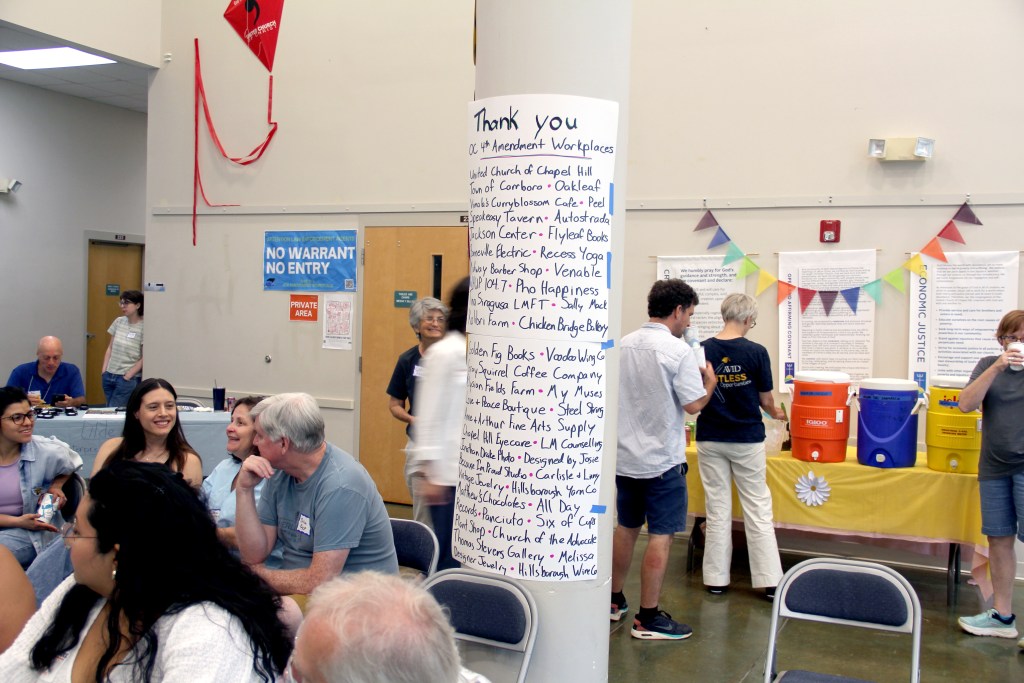 A list of Orange County businesses participating in Fourth Amendment Workplaces, displayed during an August celebration of the initiative.