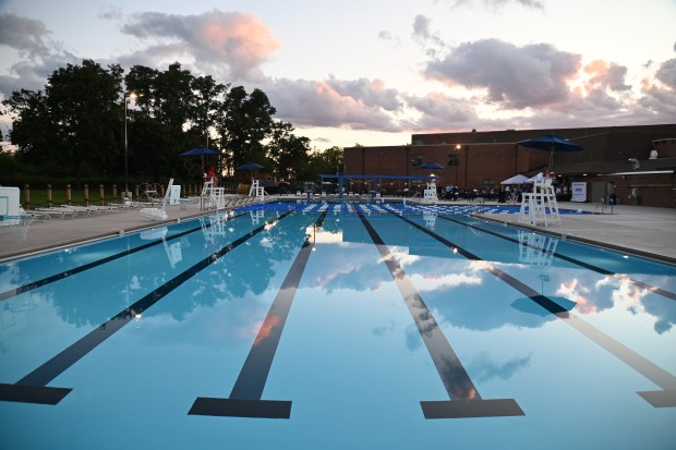 Sunset hues color the clouds over the pool during the VIP Pool Party at Blair Park pool in Lake Bluff on Aug. 26, 2025. (Karie Angell Luc/Pioneer Press)