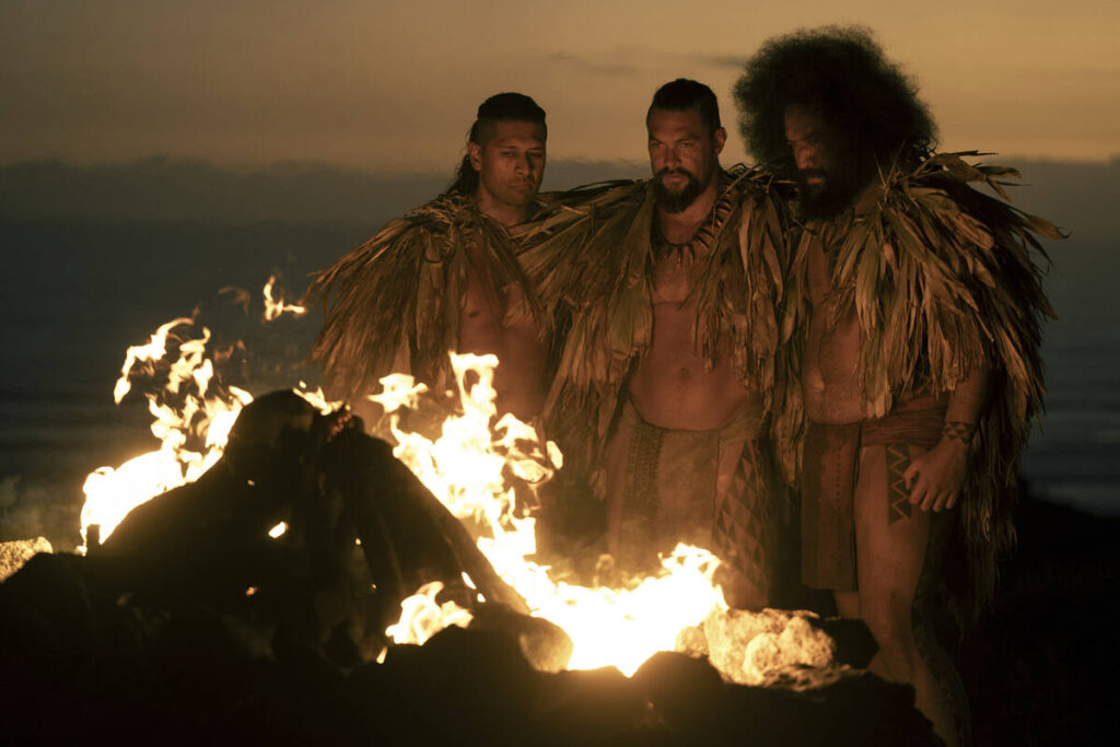 This image released by Apple TV+ shows Te Kohe Tuhaka, from left, Jason Momoa and Siua Ikale'o ...