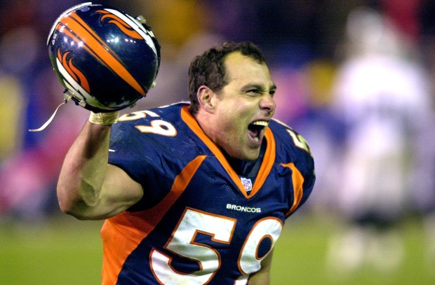 Denver Broncos linebacker Glenn Cadrez celebrates the Broncos' overtime win over the Oakland Raiders on Nov. 25, 1999. (Photo By John Leyba/The Denver Post)