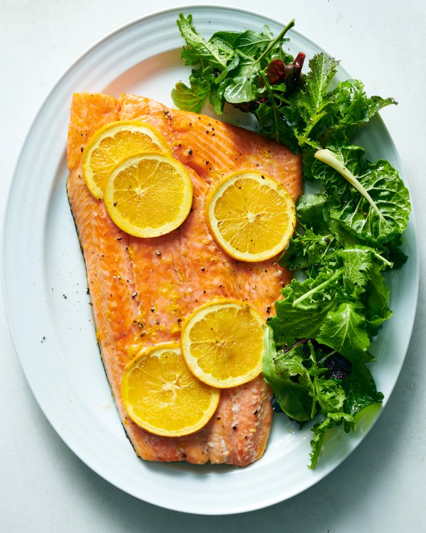 Orange-glazed baked salmon. Baking salmon gently at a low temperature is a low-effort approach that results in a flaky, moist piece of fish. Food styled by Hadas Smirnoff. (David Malosh, The New York Times)