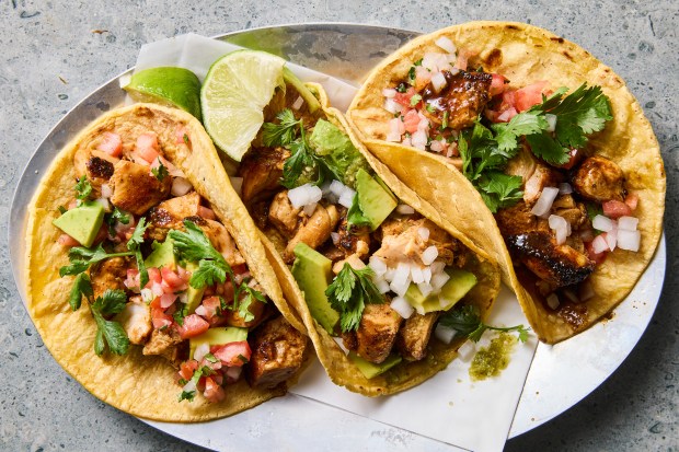 Easy chicken tacos. Tender chicken tacos using boneless, skinless thighs make a flavorful weeknight meal that, if you warm up your tortillas while the chicken cooks, will be ready in about half an hour. Food styled by Simon Andrews. (Christopher Testani, The New York Times)