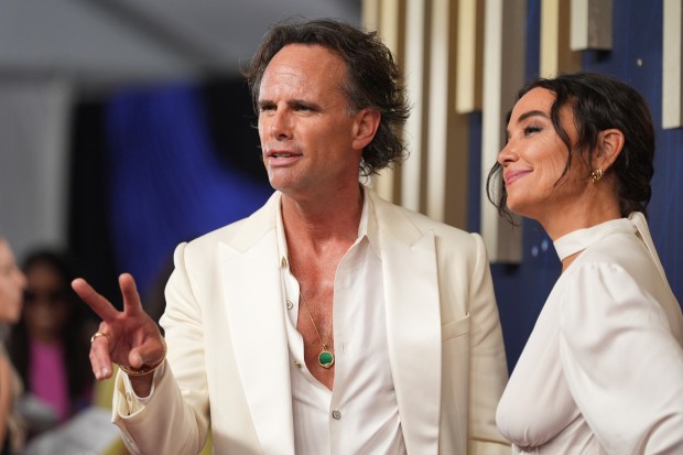 Walton Goggins, left, and Nadia Conners arrive at the 77th...
