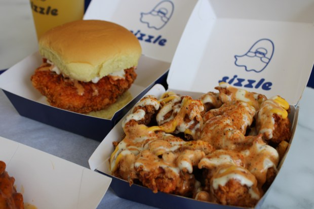 The Sizzle Bird sandwich and Loaded Fries from Sizzle. Brothers Shafath and Fazilath Baig opened the downtown Skokie resident in Sept.. (Richard Requena/Pioneer Press)