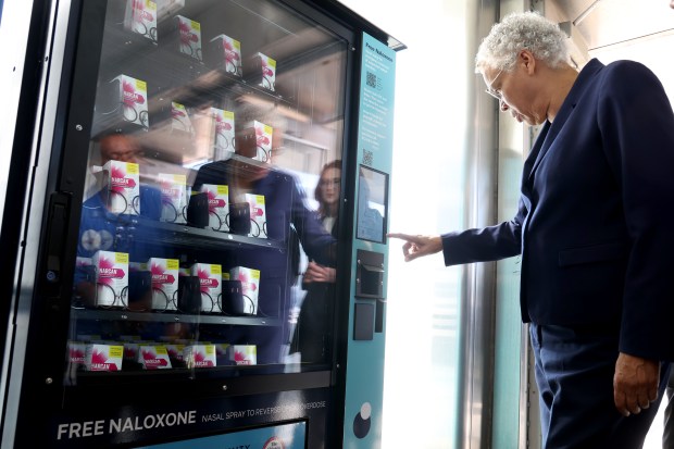 Cook County Board President Toni Preckwinkle tries out a new Naloxone vending machine at the 47th Street CTA Red Line station in Chicago on Sept. 15, 2025. Naloxone is an overdose-reversing medication, also known by the brand name Narcan. (Antonio Perez/Chicago Tribune)