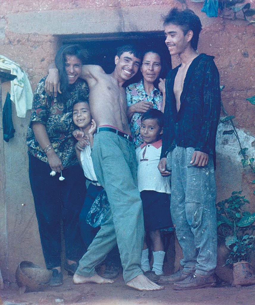 Chavarria (in white shirt with red collar) with his family circa 1995