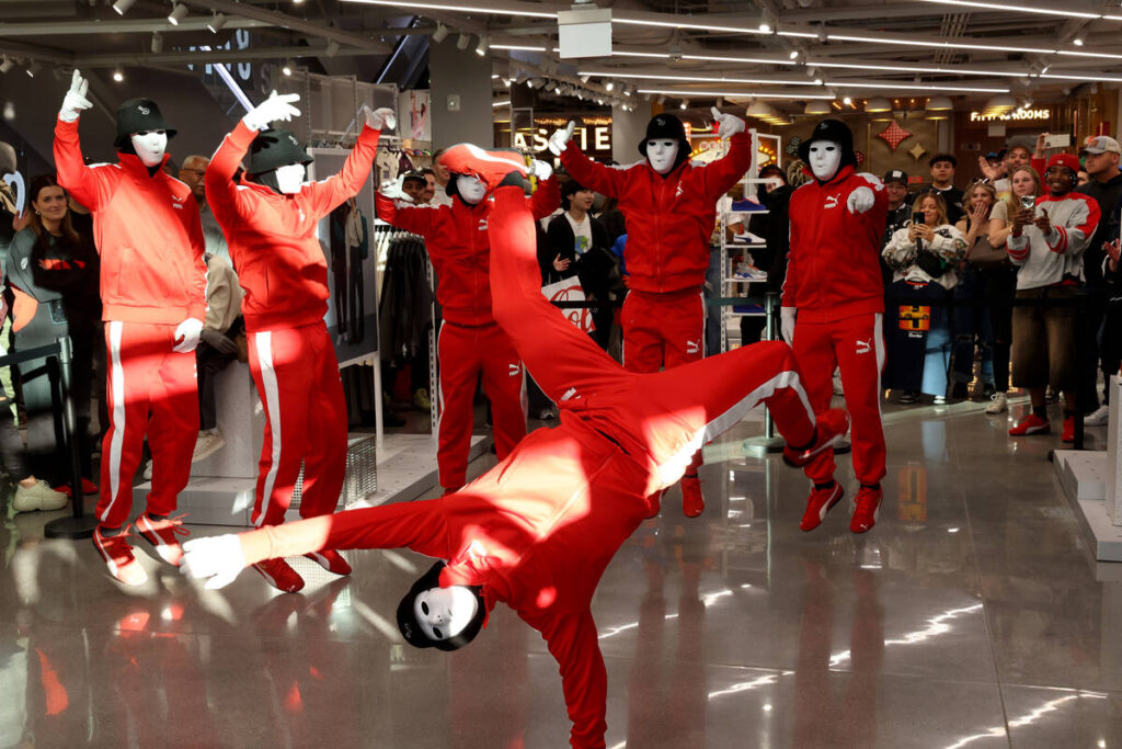 Jabbawockeez perform during the grand opening of PUMA on the Strip in Las Vegas Thursday, Nov. ...