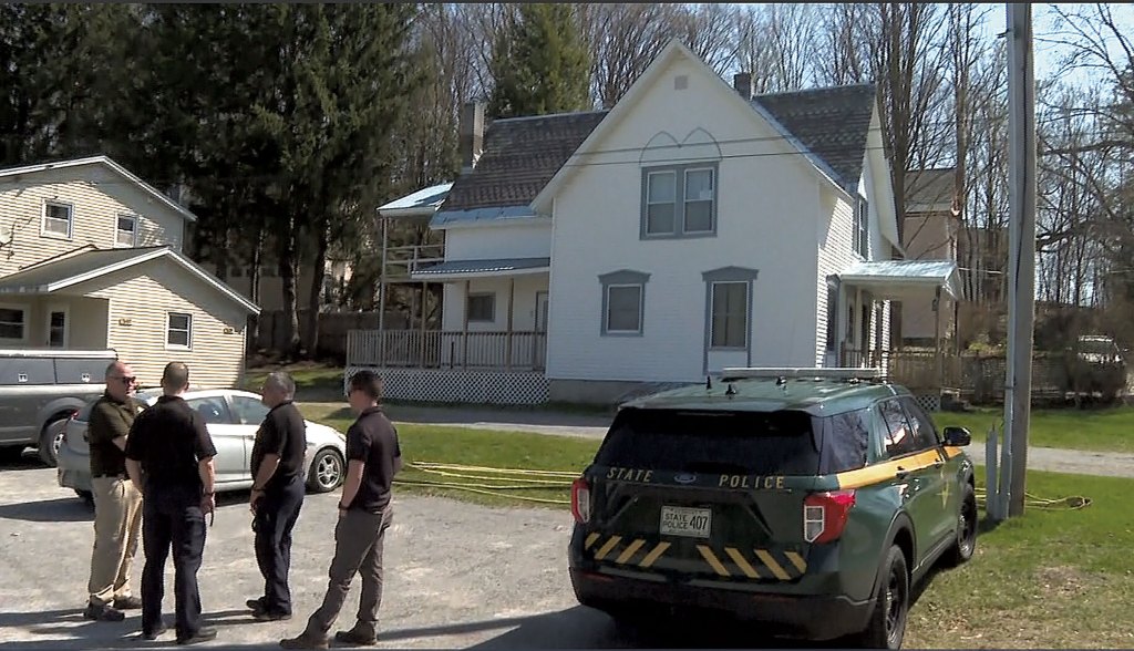 Police outside Aaron LaRoche's apartment after the standoff