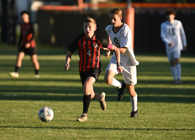 Beecher's Gavin Graham (4) races up field against Grant Park's Ian Hamann (9) during the River Valley Conference Tournament Wednesday, Oct. 8, 2025 in Beecher, IL. (Steve Johnston/for the Daily Southtown)
