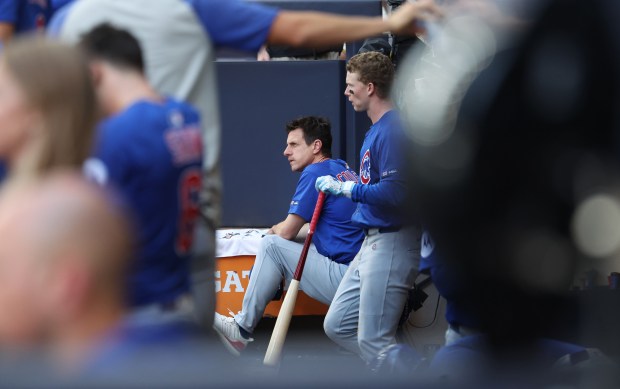 Cubs manager Craig Counsell looks out of the dugout in...