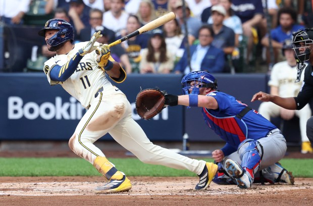 Milwaukee Brewers left fielder Jackson Chourio (11) drives in two...