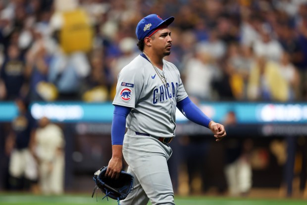 Chicago Cubs pitcher Daniel Palencia (48) walks to the dugout...