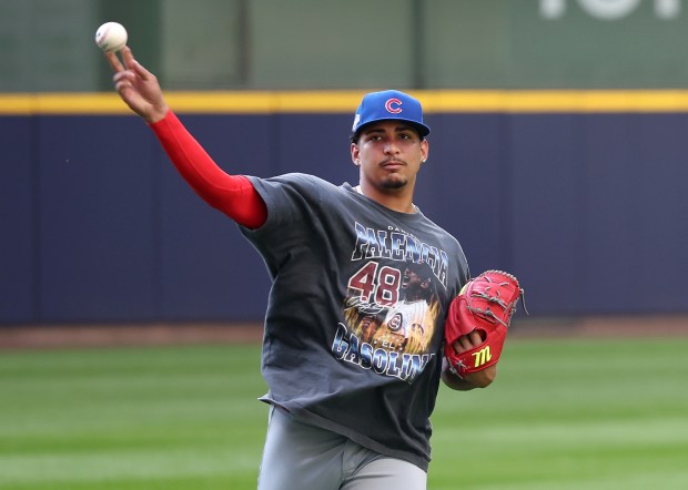 Chicago Cubs relief pitcher Daniel Palencia (48) warms up for...