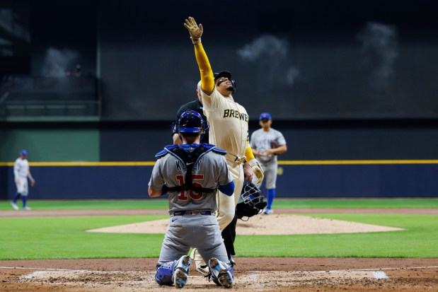 Milwaukee Brewers catcher William Contreras (24) crosses home plate after...